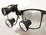 ErgonoptiX-D-Light-micro -LED surgical headlamp with prismatic-loupes-mount